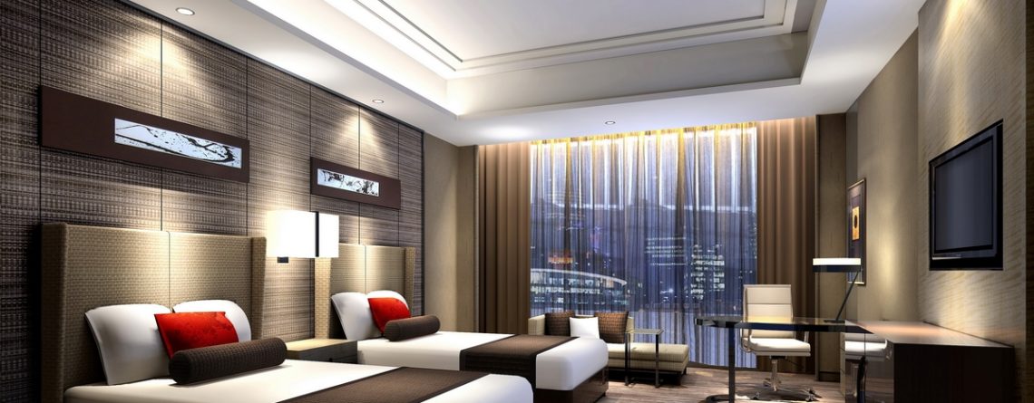 Luxury hotel guest room with bed, furniture, lighting, and amenities featured in a complete hotel equipment list guide.