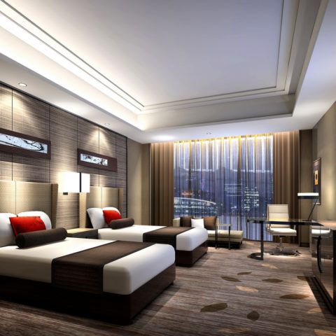 Luxury hotel guest room with bed, furniture, lighting, and amenities featured in a complete hotel equipment list guide.