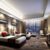 Luxury hotel guest room with bed, furniture, lighting, and amenities featured in a complete hotel equipment list guide.